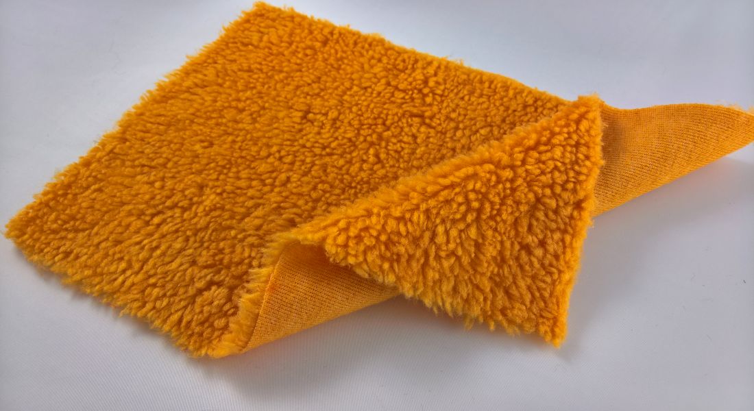 Leskymo beránek, oranžový, šíře 150cm (metráž)